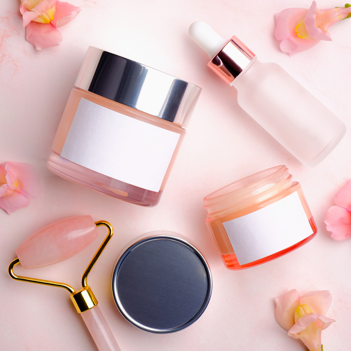 various cosmetic products on a skin care beauty cream serum
